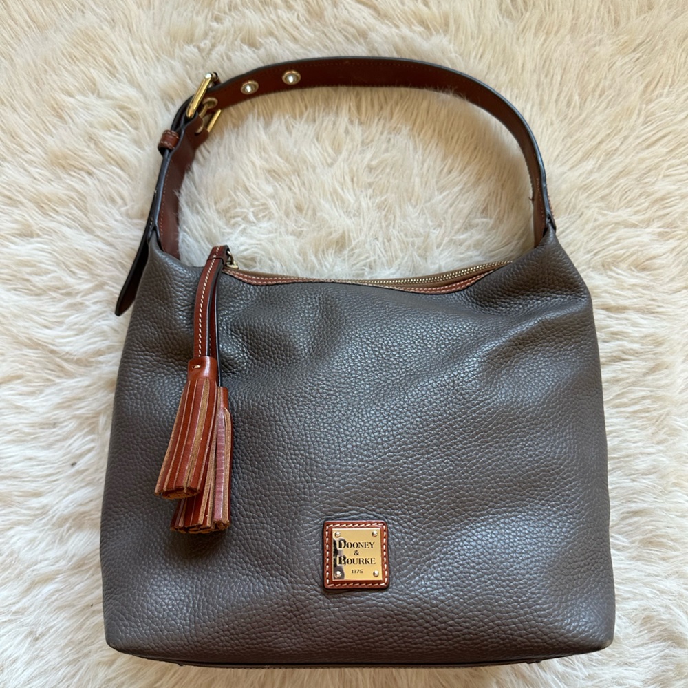 Dooney & Bourke mushroom Gray with brown shoulder strap and tassel hobo bag